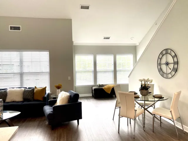 a living room with furniture and a large window
