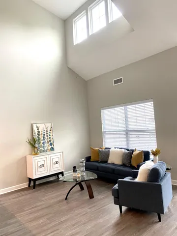 a living room with furniture and a window