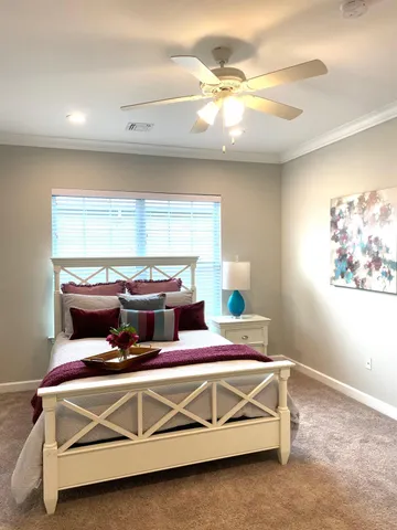 a bedroom with a bed and window