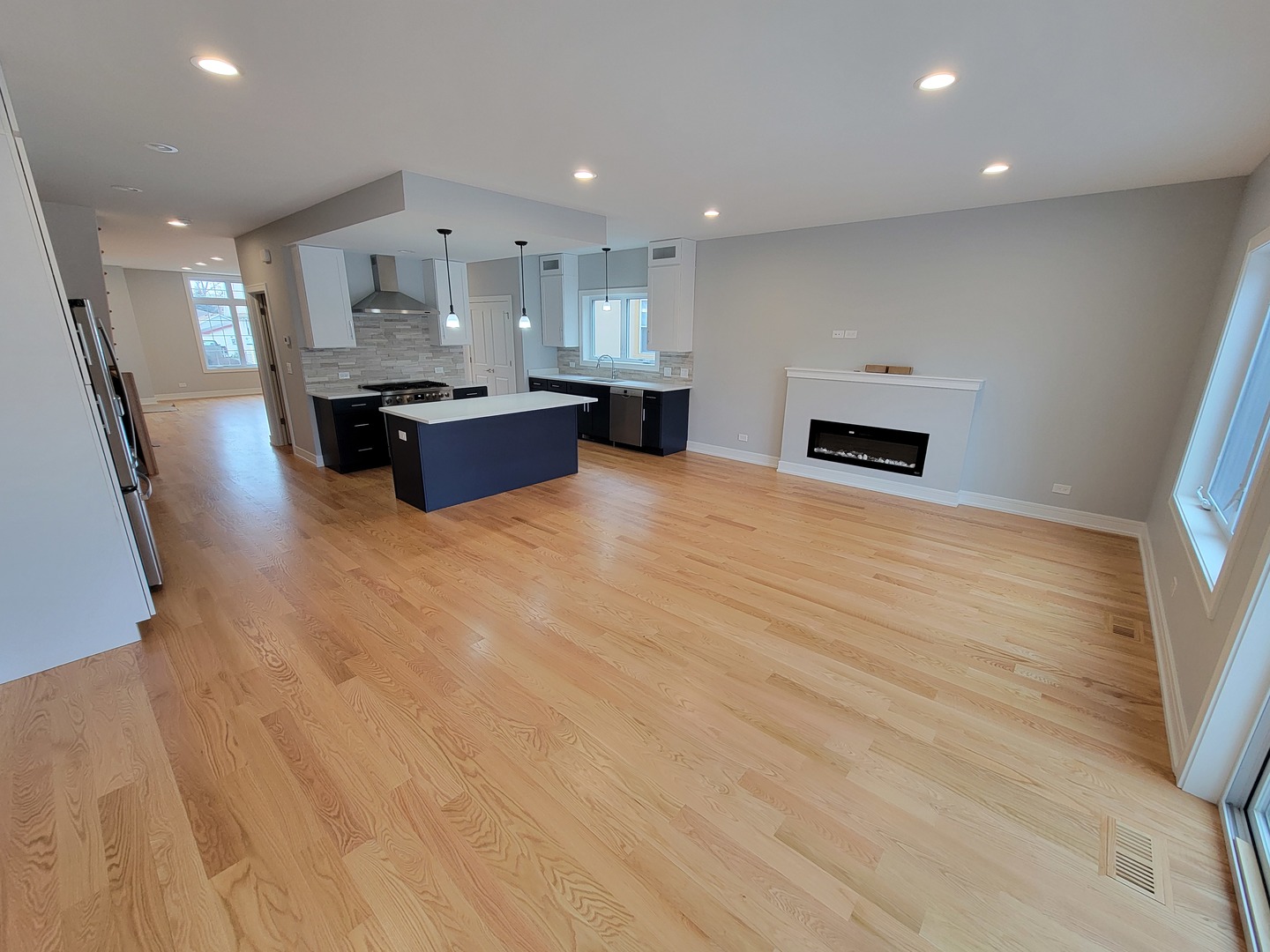 2918 North Rutherford Avenue Chicago, IL 60634 - Photo 4 of 18 a kitchen with stainless steel appliances kitchen island granite countertop a stove a sink and a refrigerator