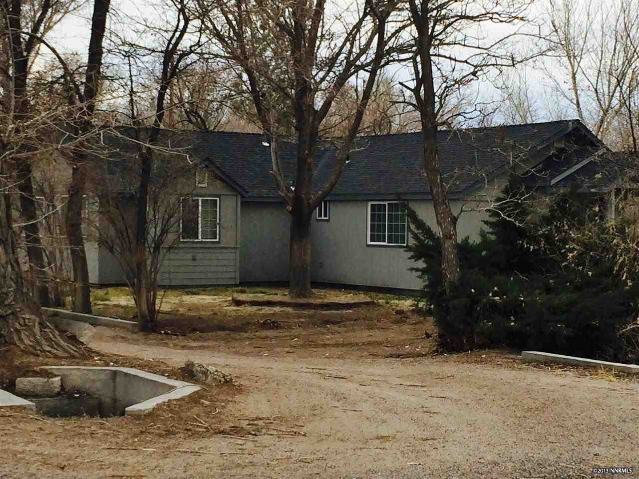 a view of a house with snow on the tree