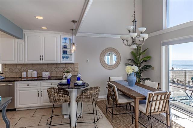 317 Beach Drive Aptos, CA 95003 - Photo 14 of 41 a dining room filled chandelier and wooden floor
