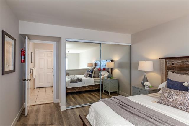 317 Beach Drive Aptos, CA 95003 - Photo 17 of 41 a bedroom with bed and wooden floor