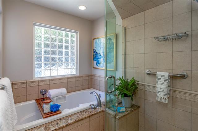 317 Beach Drive Aptos, CA 95003 - Photo 22 of 41 a white bath tub sitting in a bathroom next to a window