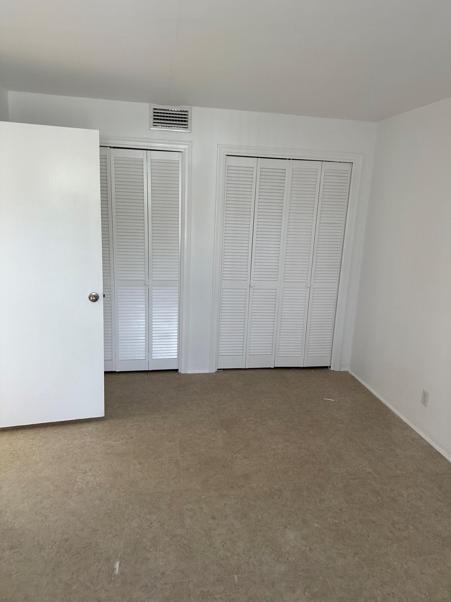 482 Southwest 9th Street, Unit 14 Boca Raton, FL 33432 - Photo 3 of 6 a view of an empty room