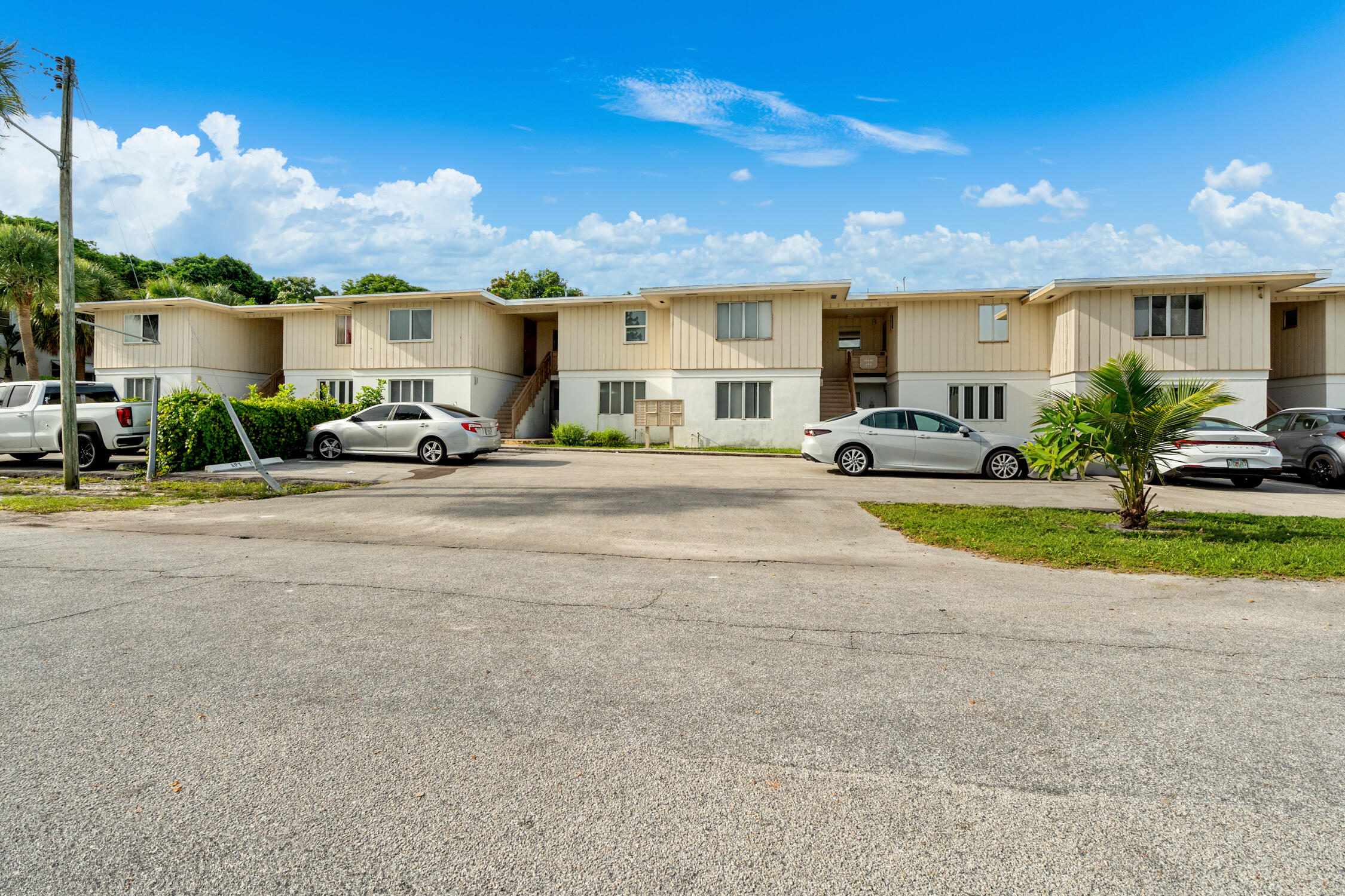 482 Southwest 9th Street, Unit 14 Boca Raton, FL 33432 - Photo 6 of 6 a view of a house with a patio