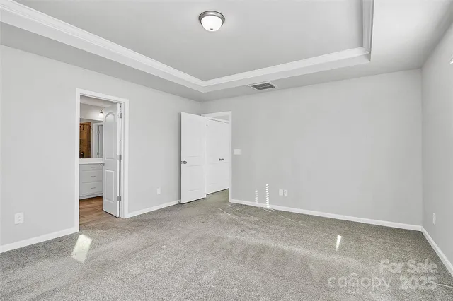 a bathroom with a double vanity sink a mirror and a shower