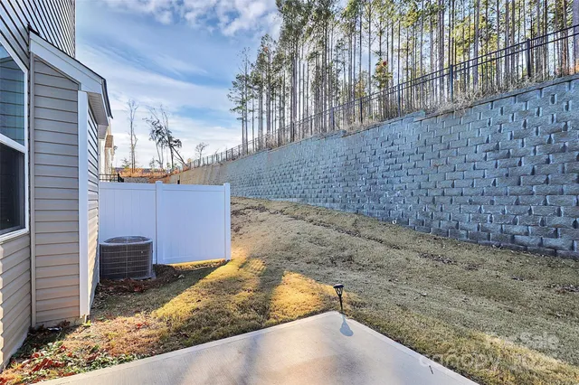 a view of a house with potted plants
