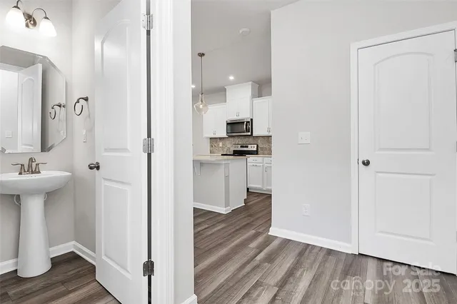 a view of a kitchen from the hallway