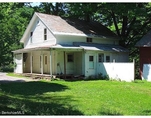 45 Bray Road Shelburne Falls, MA 01370 - Photo 2 of 18 a front view of a house with a yard and garage