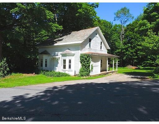 45 Bray Road Shelburne Falls, MA 01370 - Photo 18 of 18 a front view of a house with a yard and garage