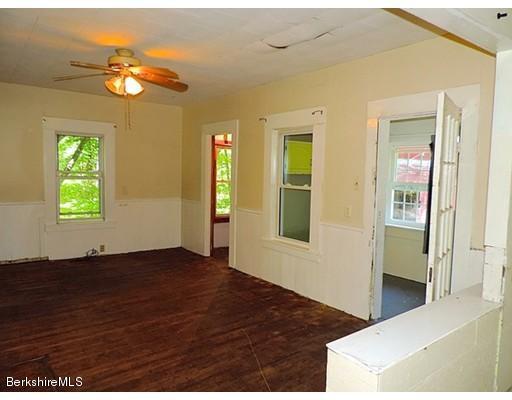 45 Bray Road Shelburne Falls, MA 01370 - Photo 6 of 18 a view of an empty room with window and wooden floor