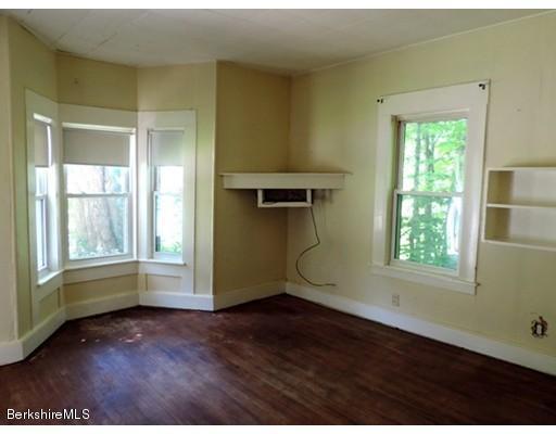 45 Bray Road Shelburne Falls, MA 01370 - Photo 8 of 18 an empty room with wooden floor and windows
