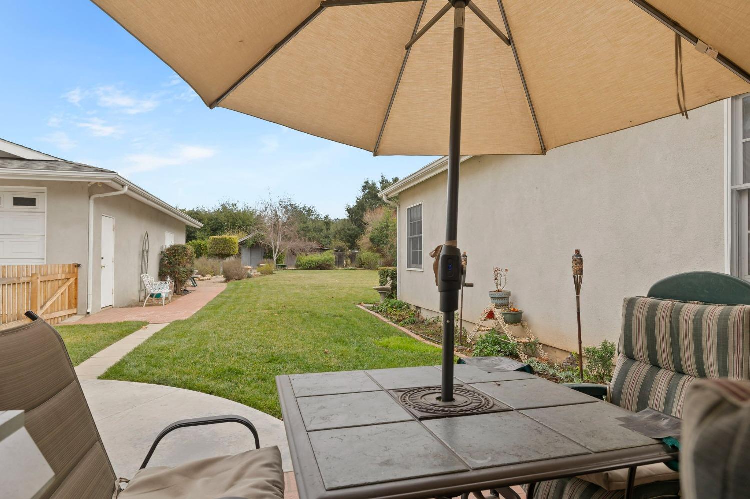 1928 South Rice Road Ojai, CA 93023 - Photo 13 of 41 a view of a patio with a table chairs under an umbrella