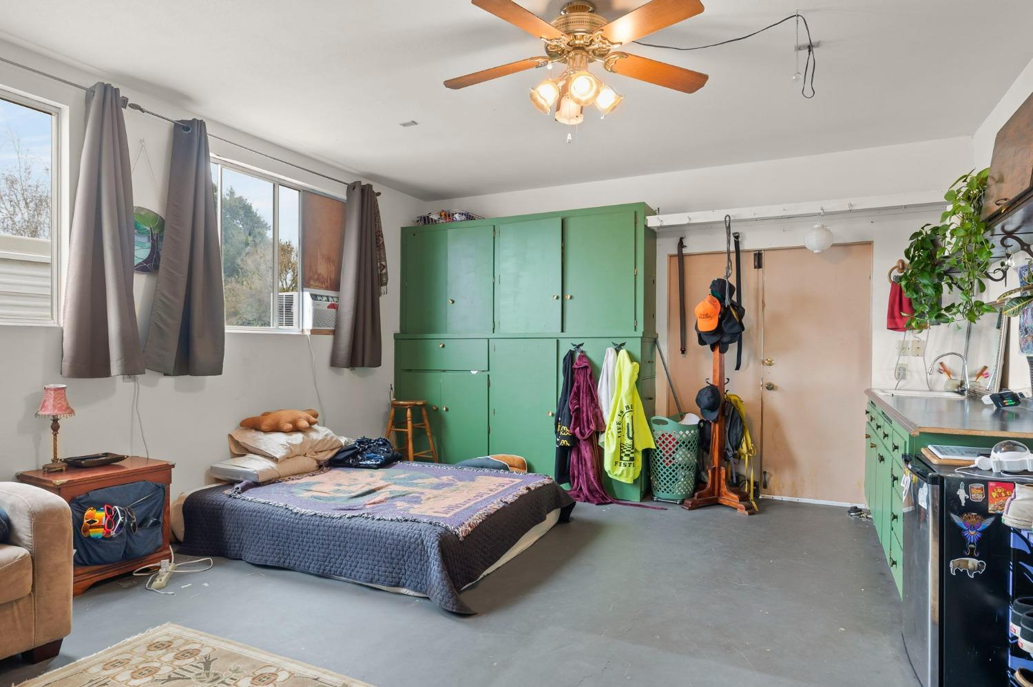 1928 South Rice Road Ojai, CA 93023 - Photo 24 of 41 a bedroom with a bed and a chandelier