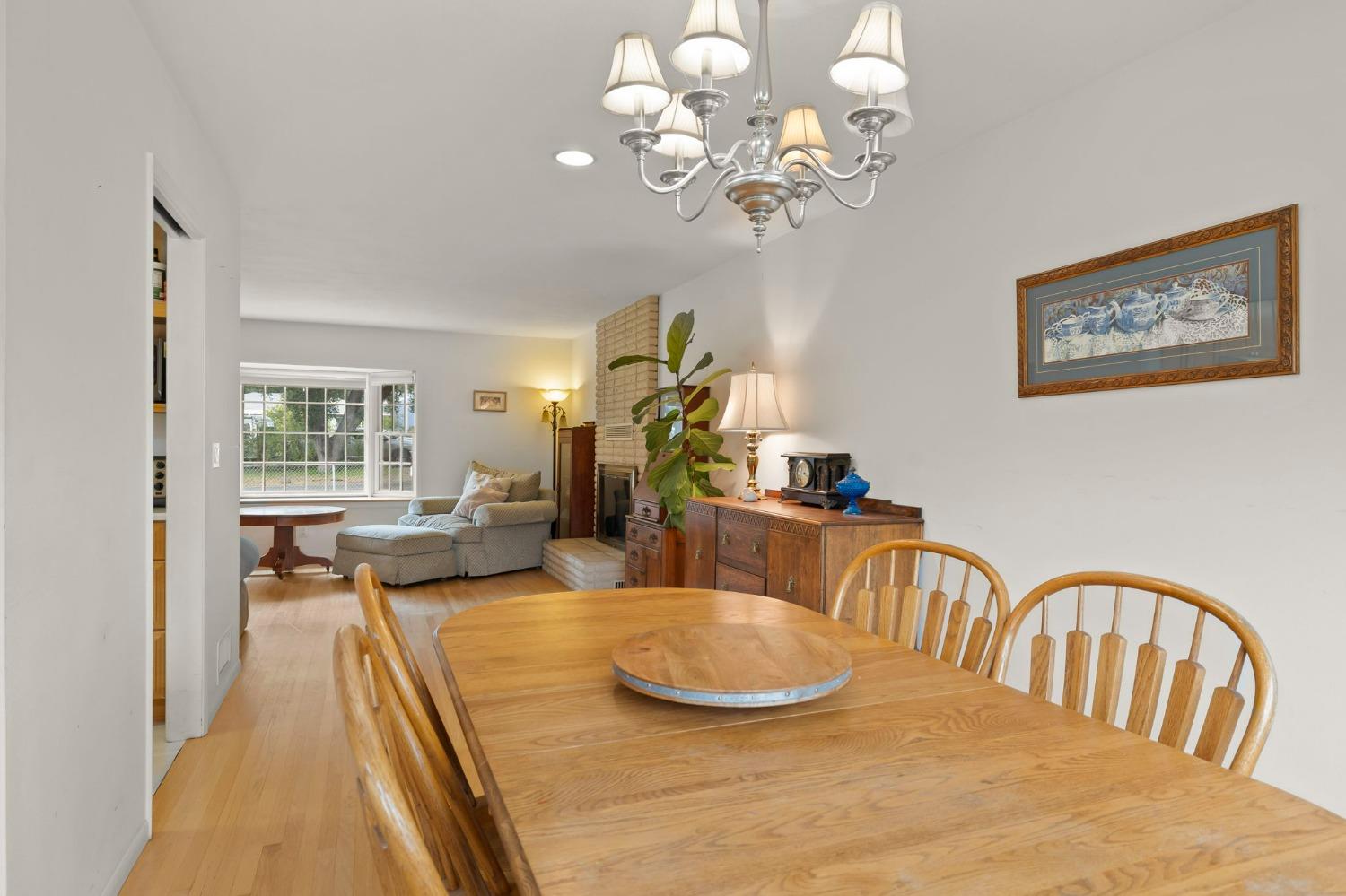 1928 South Rice Road Ojai, CA 93023 - Photo 7 of 41 a view of a dining room with furniture wooden floor and chandelier
