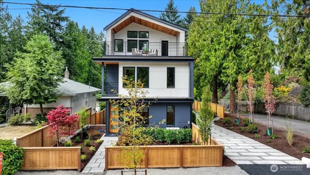 a front view of a house with tree s