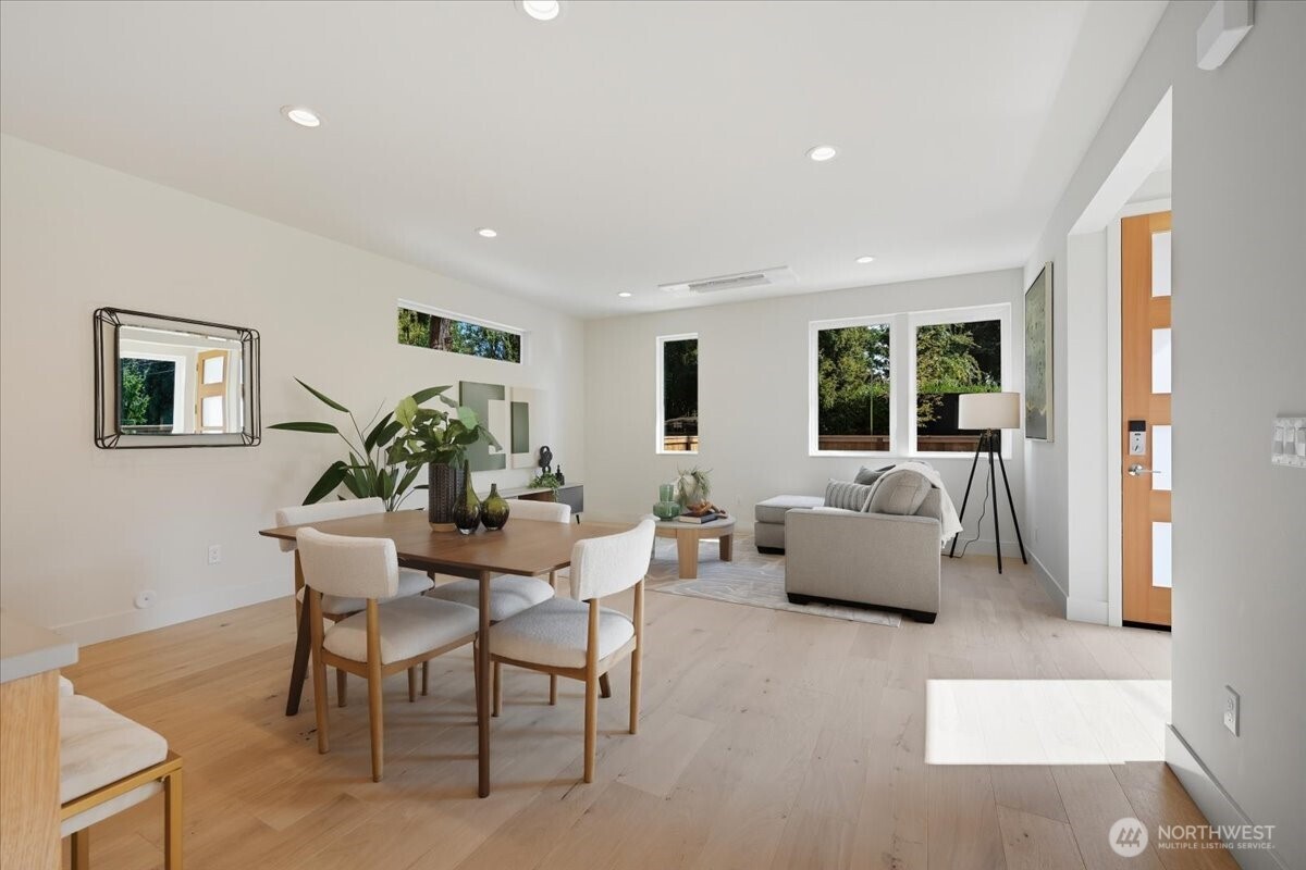 13047 39th Avenue Northeast, Unit A Seattle, WA 98125 - Photo 13 of 23 a living room with furniture and a potted plant