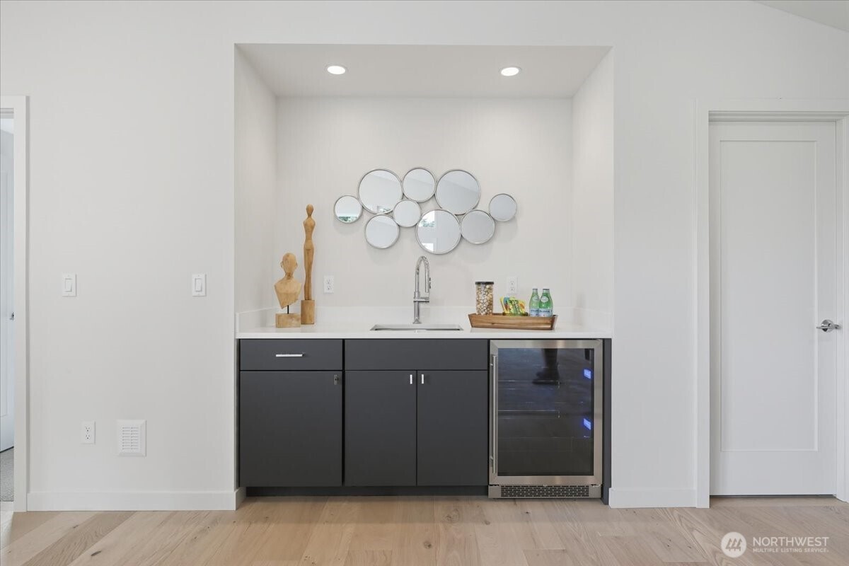 13047 39th Avenue Northeast, Unit A Seattle, WA 98125 - Photo 15 of 23 a bathroom with a sink and a mirror