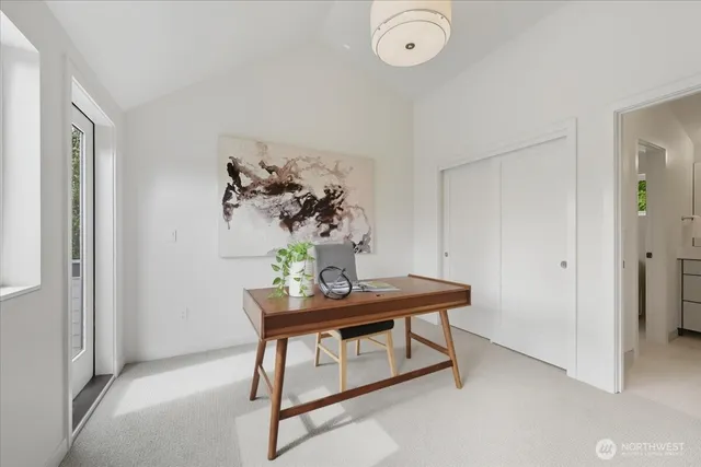 a view of a room that has a table and chair in it