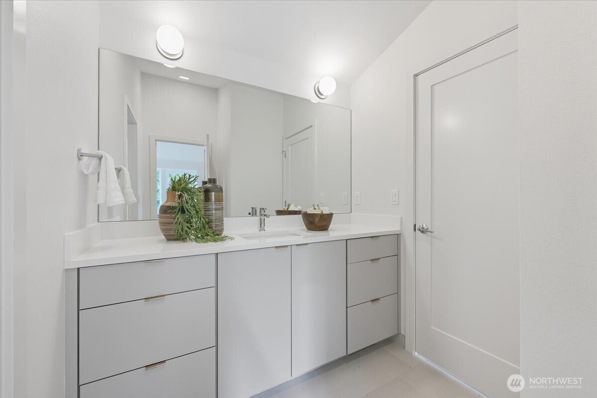 13047 39th Avenue Northeast, Unit A Seattle, WA 98125 - Photo 18 of 23 a bathroom with a sink and mirror