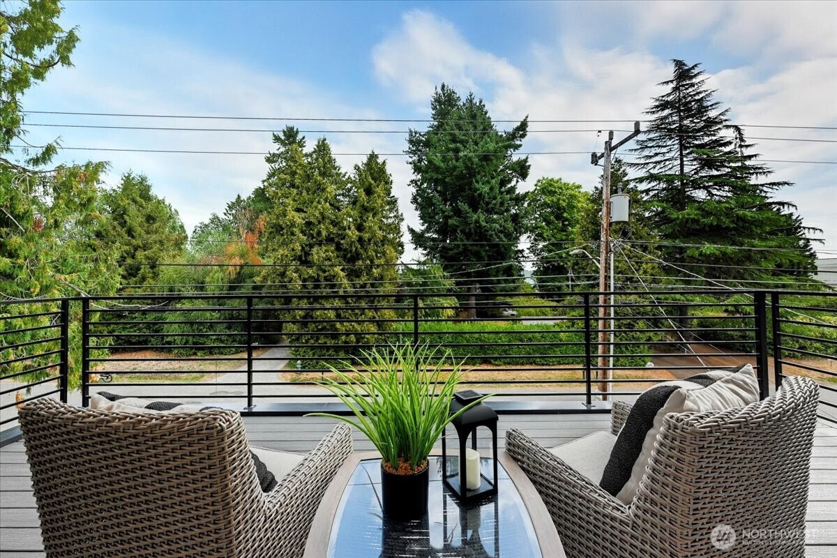 13047 39th Avenue Northeast, Unit A Seattle, WA 98125 - Photo 20 of 23 a view of balcony with couch and chairs