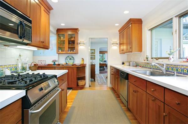 27 Kingsbury Road Newton, MA 02467 - Photo 5 of 9 a kitchen with stainless steel appliances a sink stove and cabinets