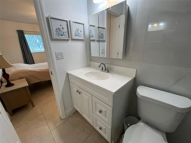 a spacious bathroom with a double vanity sink and a mirror