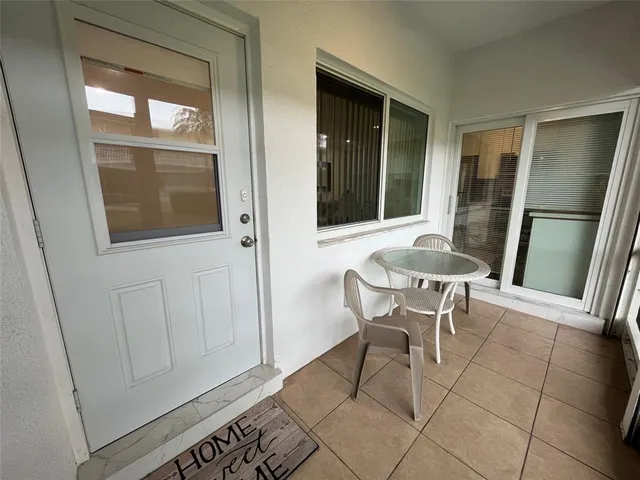a view of a room with furniture and window
