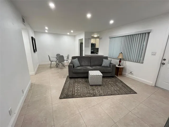 a living room with furniture and a rug