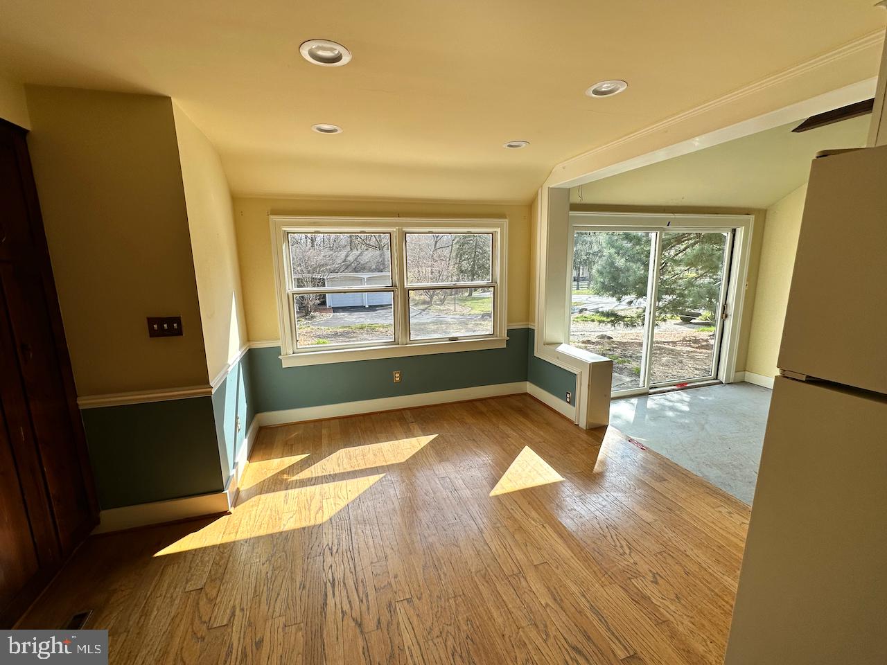 61 Devon Road Paoli, PA 19301 - Photo 3 of 25 a view of an empty room with wooden floor and a window