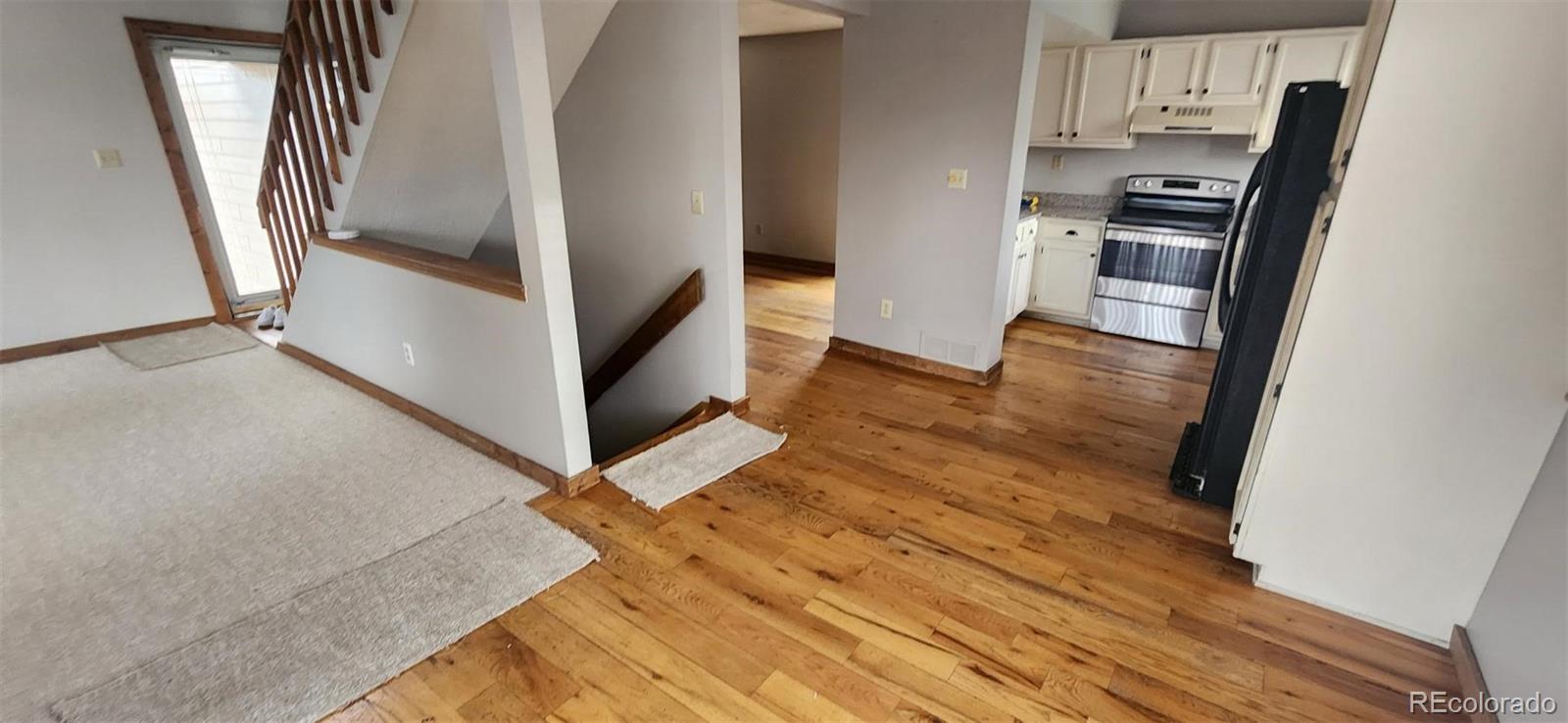 8901 Bermuda Run Circle Highlands Ranch, CO 80130 - Photo 4 of 17 a view of a kitchen from the hallway