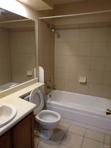 a bathroom with a sink a toilet and a bathtub