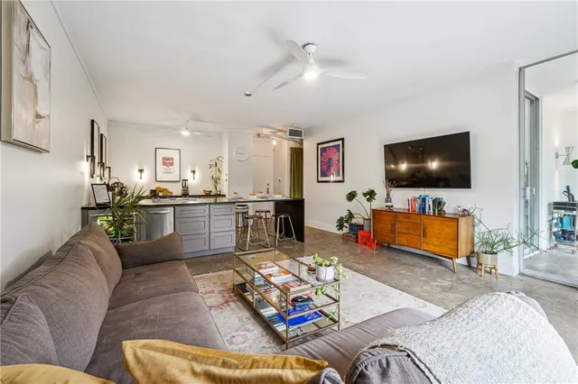 a living room with furniture and a large window