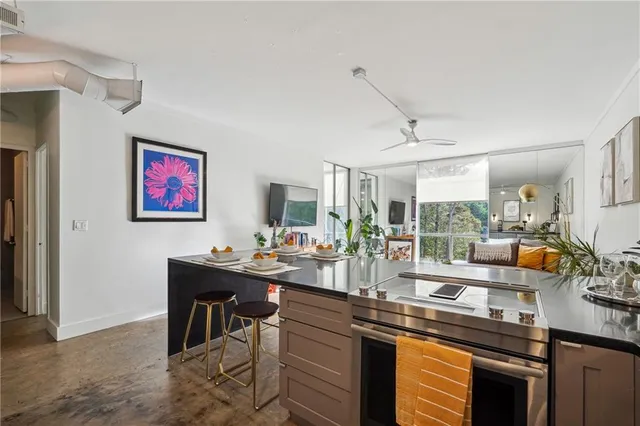 a view of a kitchen with dining table and chairs
