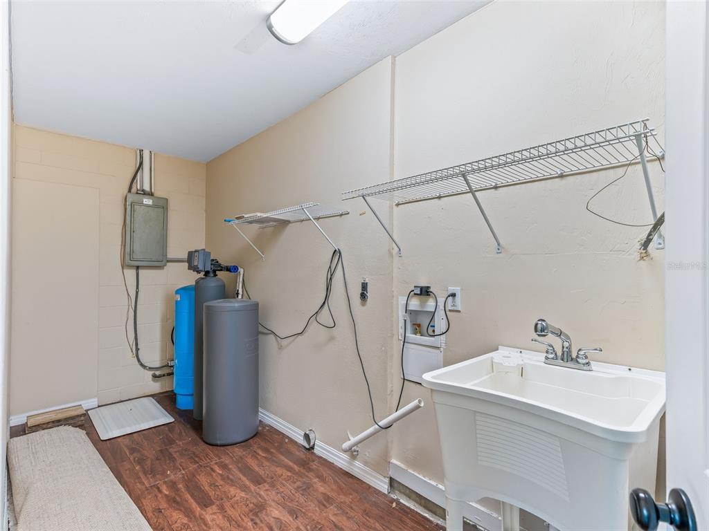 2405 Southeast 157th Lane Road Summerfield, FL 34491 - Photo 26 of 35 a bathroom with a sink a mirror and shower
