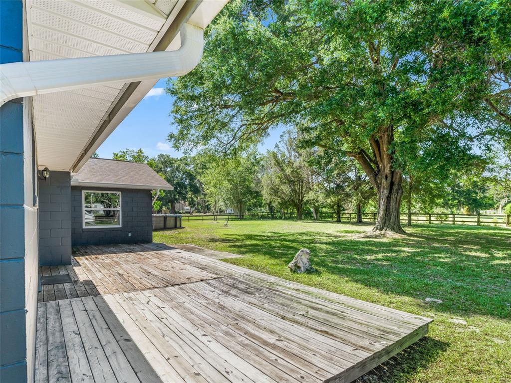 2405 Southeast 157th Lane Road Summerfield, FL 34491 - Photo 27 of 35 a view of a house with a yard
