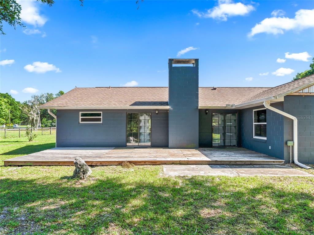 2405 Southeast 157th Lane Road Summerfield, FL 34491 - Photo 28 of 35 a front view of a house with a yard