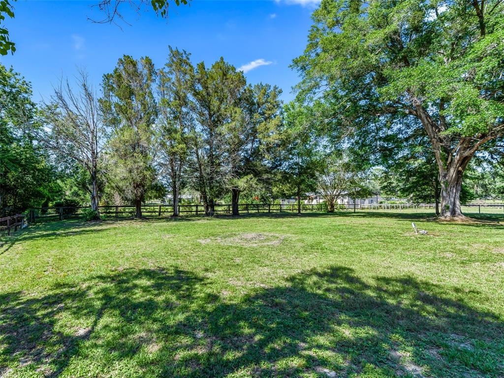 2405 Southeast 157th Lane Road Summerfield, FL 34491 - Photo 33 of 35 a view of outdoor space with deck and yard