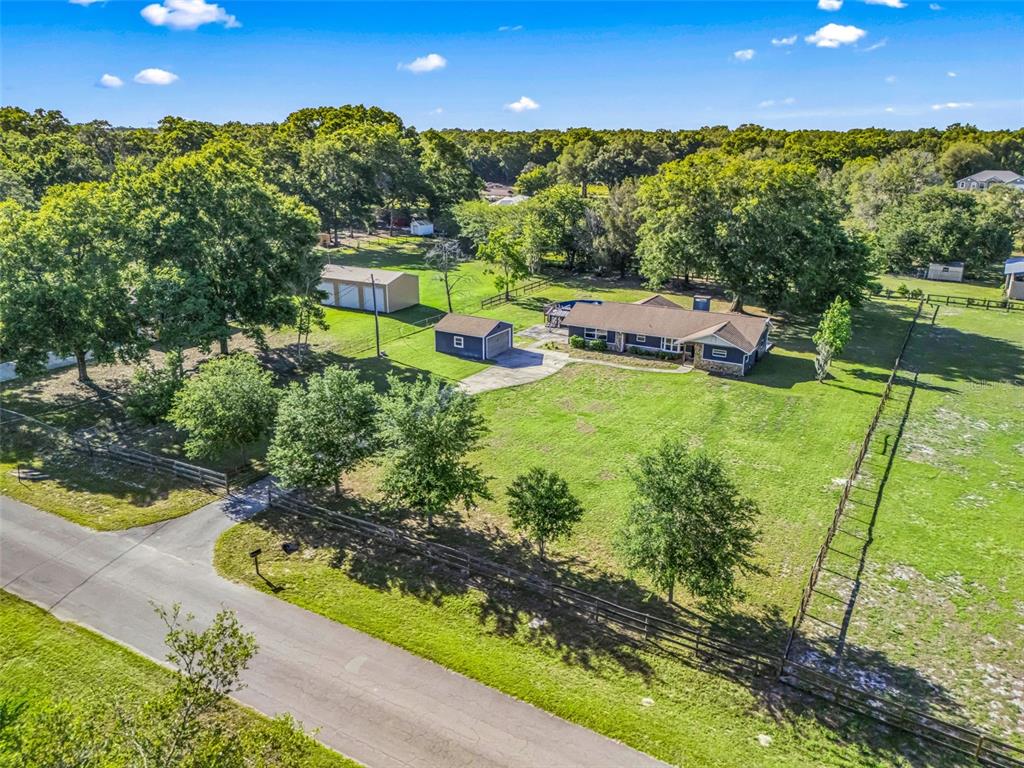 2405 Southeast 157th Lane Road Summerfield, FL 34491 - Photo 35 of 35 a aerial view of a house with yard swimming pool and outdoor seating