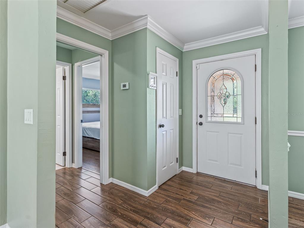 2405 Southeast 157th Lane Road Summerfield, FL 34491 - Photo 6 of 35 a view of livingroom with window and wooden floor