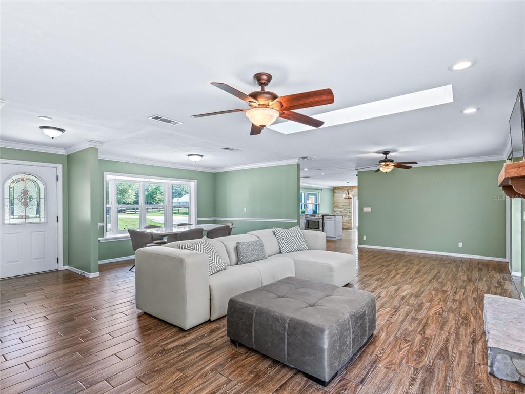 2405 Southeast 157th Lane Road Summerfield, FL 34491 - Photo 8 of 35 a living room with furniture and a large window