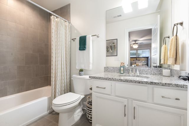 a bathroom with a toilet and a bathtub