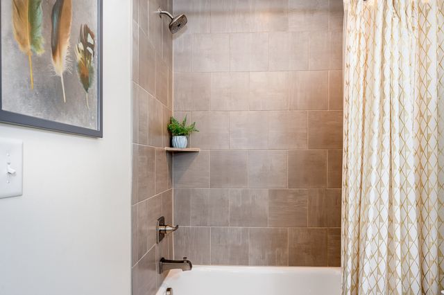 a bedroom with a bed and a desk