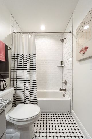 a view of a balcony with chairs and table