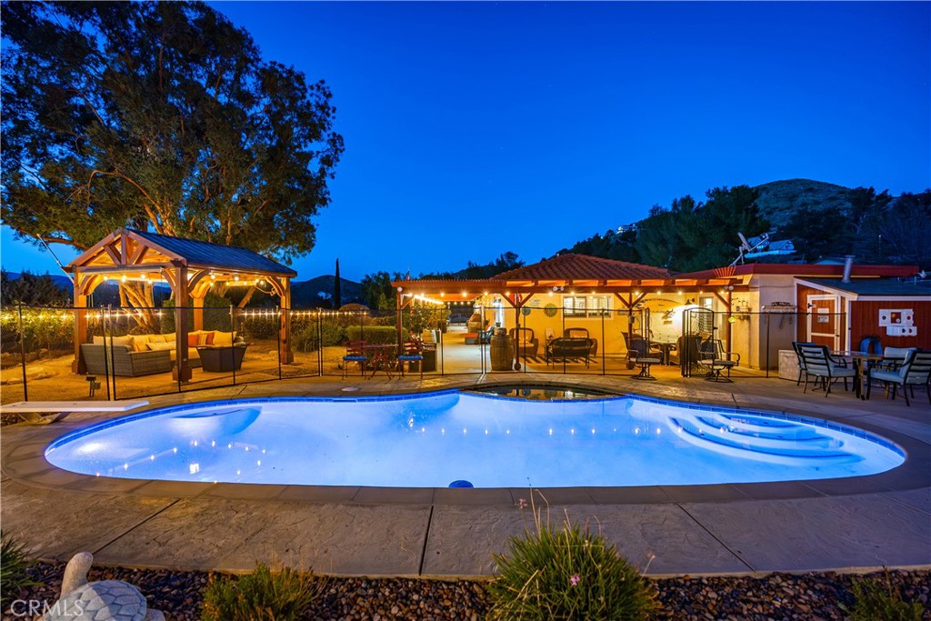 2862 Calmgarden Road Acton, CA 93510 - Photo 42 of 69 a view of an swimming pool with an outdoor seating