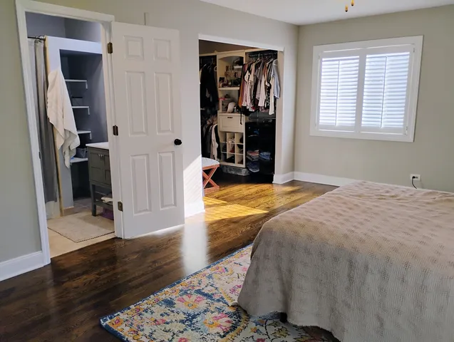 a bed room with a bed and a window