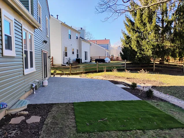 a view of swimming pool with outdoor seating and yard