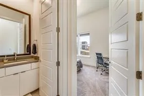 a en suite bathroom with a sink a mirror and a shower