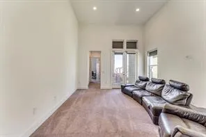 a living room with furniture and windows